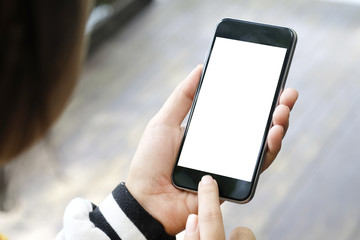 Mockup smartphone on female hands empty display.