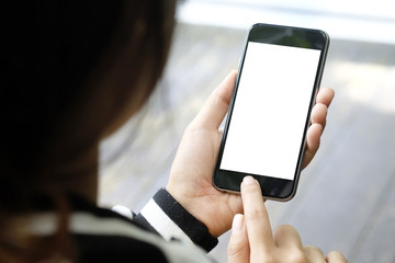 Mockup smartphone on female hands empty display.
