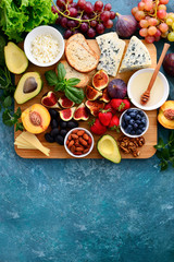 Assorted healthy cheese and fruits light snack