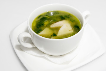 Japanese hot miso soup in a white bowl on a saucer with a napkin. Vegetarian dish. fresh soup with tofu