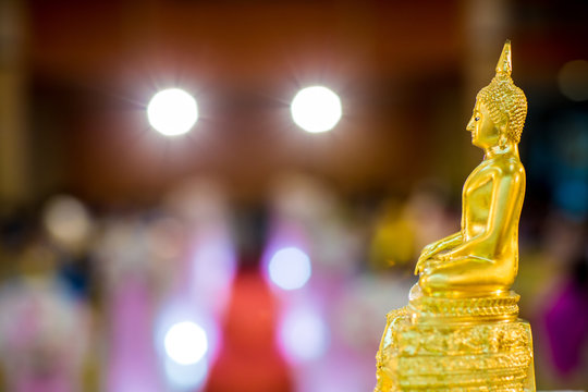 gold buddha statue on the table. symbol of buddhism religion in thai wedding ceremony. imagr for objects, and background.