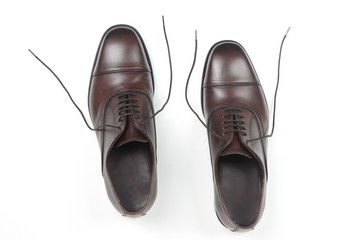 Classic men's brown Oxford shoes on white background. Leather shoes