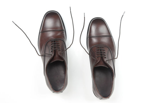 Classic men's brown Oxford shoes on white background. Leather shoes