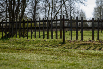 old wooden fence in the garden in countryside