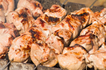 Shish kebab meat pork close-up on the grill.