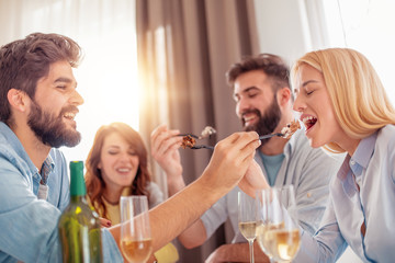 Friends enjoying together at home party