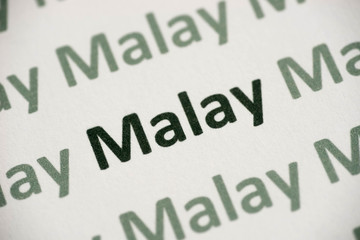 word Malay language printed on paper macro