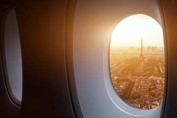 travel to Paris, view of Eiffel Tower from the window of airplane, holidays in France, Europe