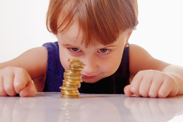 Business pyramid. Child girl counting coins. (money, success, wealth concept)