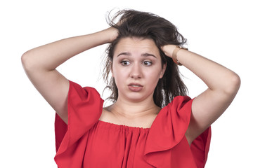 Beautiful woman grabbed her head while doing shaggy hairstyle isolated on white background