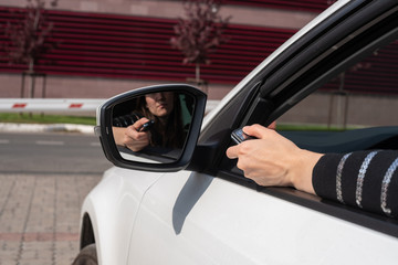 malfunctions with the automatic system of a barrier, the female hand with the panel opens gate from the car