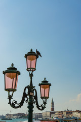 Fototapeta na wymiar View of piazza san marco and grand canal behind a typical venetian light pole, Venice, Veneto, Italy