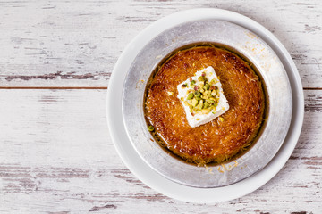 Delicious Traditional Turkish Dessert Kunefe with Pistachio and Cream