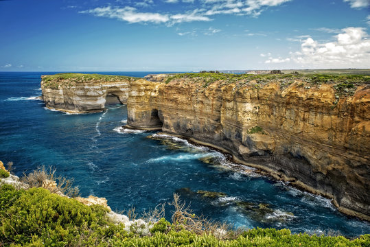 Victoria - Australia &ndash; rough costline with sandy beach and sunny blue sky