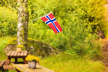 norwegian flag and green picnic site