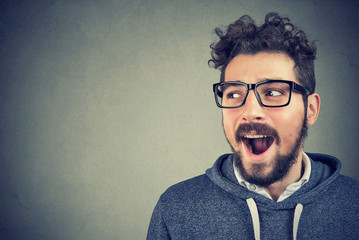 Curious excited man listening to gossips
