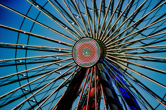 Night ferris wheel spokes with lights