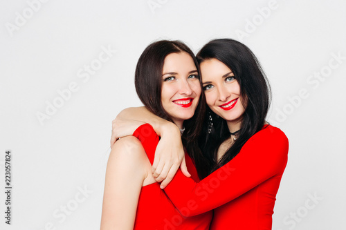 Find submissive women Brunette twins kissing