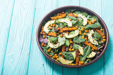 Baby spinach salad with sweet potato , chickpeas and avocado