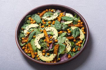 Baby spinach salad with sweet potato , chickpeas and avocado