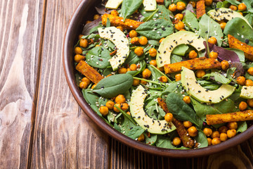 Baby spinach salad with sweet potato , chickpeas and avocado