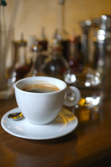 Soft focus photo of cup of coffee on bar counter with blurred background