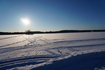 Fototapeta na wymiar Winter landscape with lake, island and sky