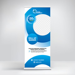 Roll-up design, modern graphic style, banner for advertising goods and services, stand for exhibitions, presentations, conferences, seminars. Abstract blue background. Template for photos and text.