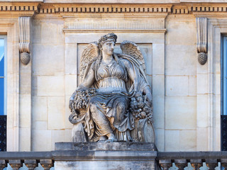 Statue positioned by balustrade of the Palais Royal (1767-1769). Palais Royal or Palais Cardinal was personal residence of Cardinal Richelieu in Paris. Located opposite the north wing of the Louvre