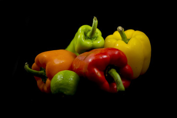 red and green peppers on white background