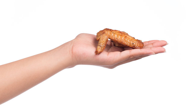 Hand Holding Roasted Chicken Wing Isolated On White Background