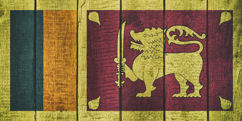 Sri Lanka National Flag on a wooden background. 