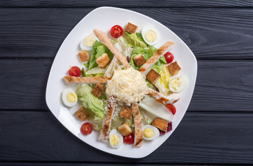 Salad ceasar with chicken , eggs and tomatoes