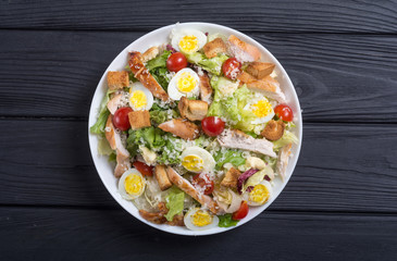 Salad ceasar with chicken , eggs and tomatoes