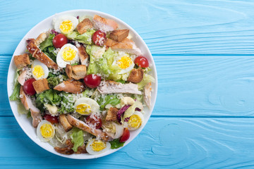 Salad ceasar with chicken , eggs and tomatoes