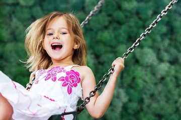 Little child blond girl having fun