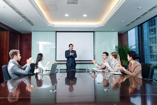Business men and women in a meeting