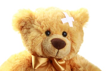 Teddy Bear with Crossed Adhesive Bandages on Head