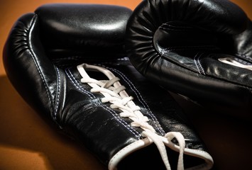 Fototapeta na wymiar Pair of Black Boxing Gloves Isolated on White