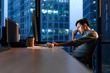 Business men in the office to work overtime