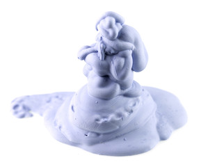 Gypsum blue figure as a sculpture on a white background
