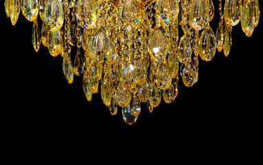 Close the crystal of modern chandelier, it is a branched decorative lamp, designed for installation on ceilings