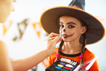 happy family  getting ready for halloween make make-up