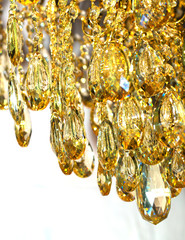 Close the crystal of modern chandelier, it is a branched decorative lamp, designed for installation on ceilings