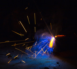 Flash and sparks from electric welding