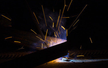 Flash and sparks from electric welding