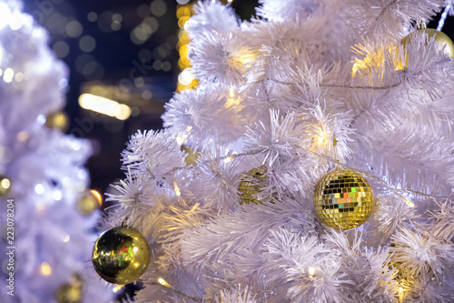 Close Up Decorated Outdoor White Tree With Colorful Lights Close Up Decorated Outdoor White Tree With Colorful Lights And Ornaments