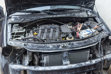 car with an open hood at the car service