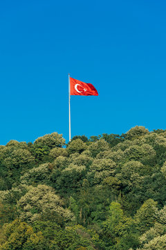 Turkish flag waving in blue sky