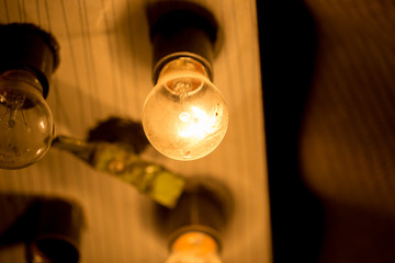 light bulb lit on a black background ,soft focus